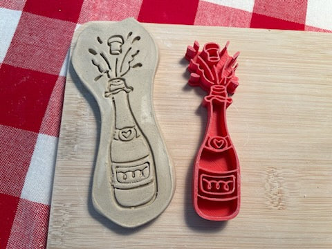Champagne bottle pottery stamp - from the 2024 February mystery