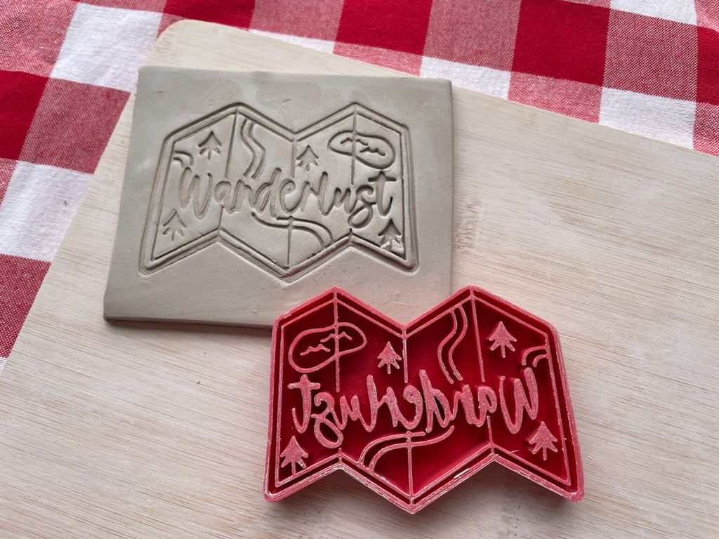 "Wanderlust" with map word pottery stamp, from the March 2024 Travel mystery box, 3d printed, multiple sizes available