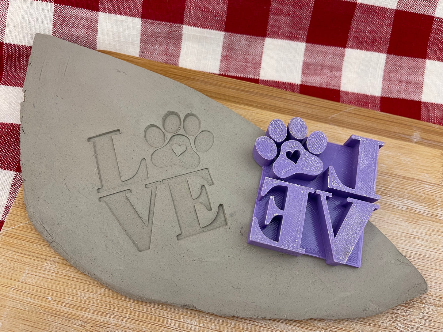 2.5" LOVE with Paw print word design, Pottery Stamp for Charity, Limited edition Purple, all money is donated to a local animal shelter
