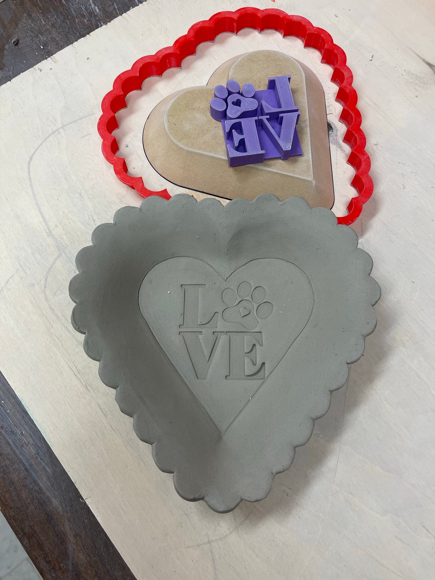 2.5" LOVE with Paw print word design, Pottery Stamp for Charity, Limited edition Purple, all money is donated to a local animal shelter