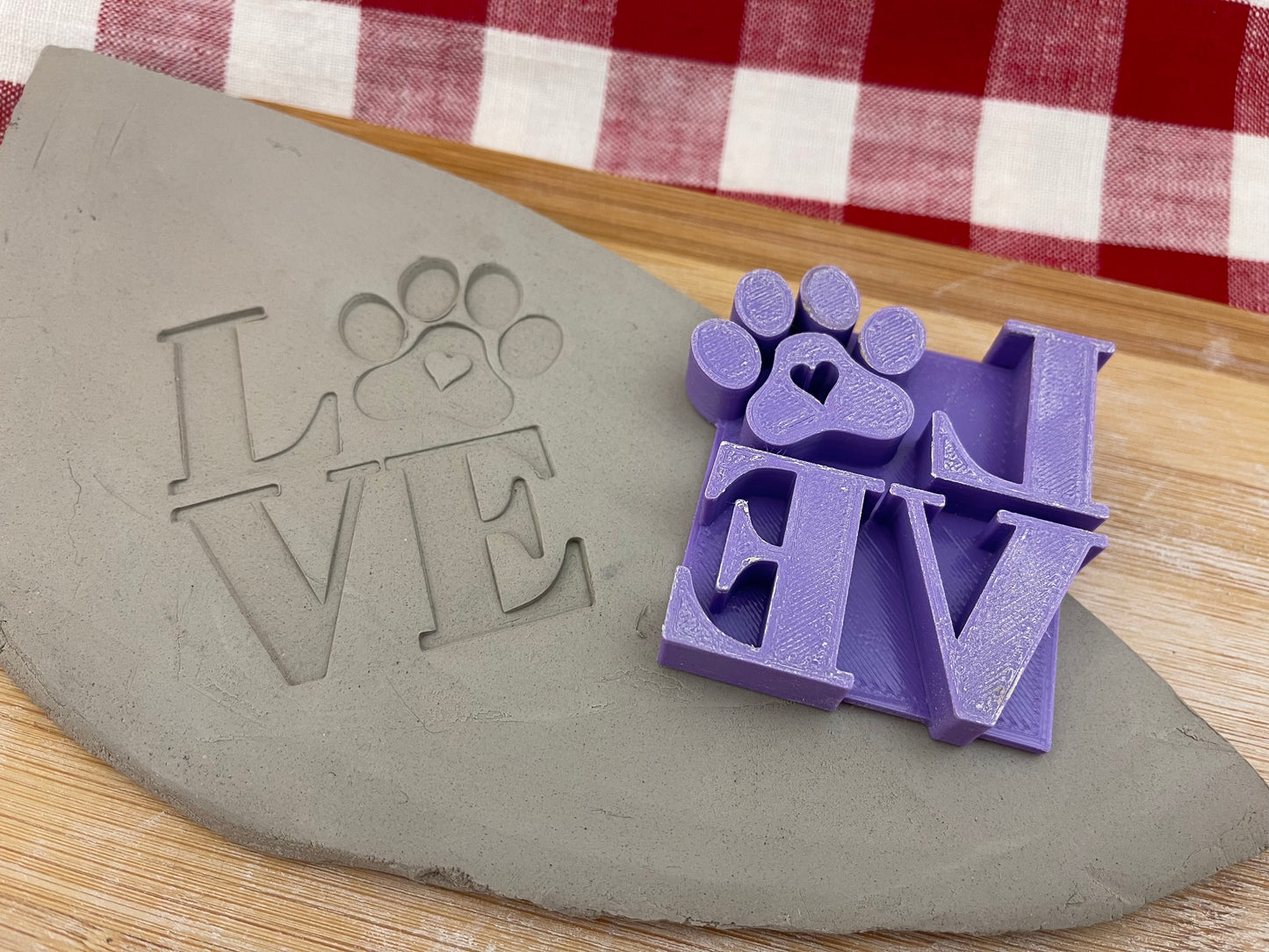 2.5" LOVE with Paw print word design, Pottery Stamp for Charity, Limited edition Purple, all money is donated to a local animal shelter